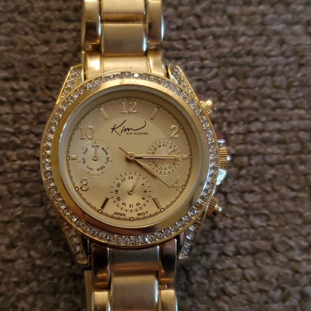 Gold Kim Roger's watch